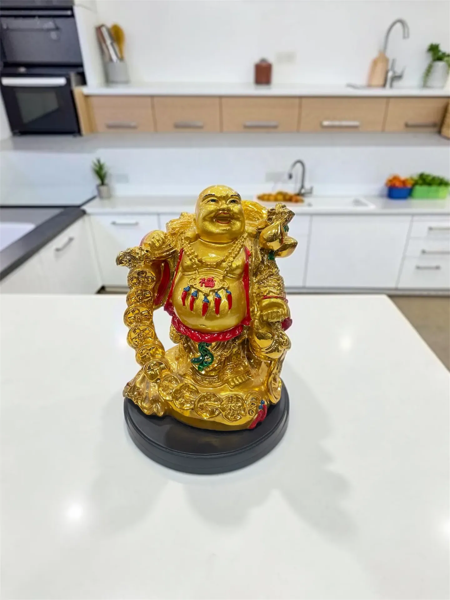 Golden plated laughing Buddha